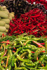 red and green peppers on a local market counter