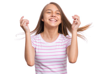 Portrait of caucasian teen girl, isolated on white background. Beautiful young teenager smiling with wind in her hair. Happy cute child laughing.