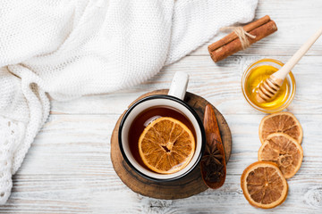 Flat lay of warm tea with orange