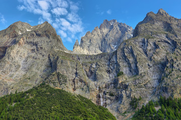 Mountains and waterfalls near in Val Veny, Aosta valley, Italy