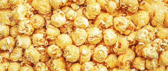 Popcorn Pattern. Caramel popcorn background. Food, cinema, movie or film design. Flat lay