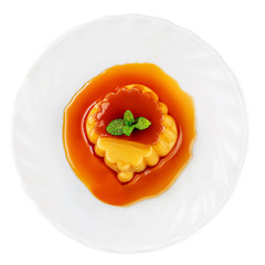 Сaramel custard pudding on white plate isolated  white background. Homemade Egg dessert. Flan Top...