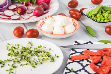 Bowl of salad with smocked salmon.