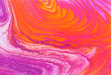 photography of abstract marbleized effect background. red, pink, orange and white creative colors....