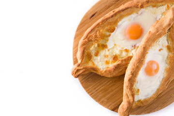 Traditional Adjarian Georgian khachapuri with cheese and egg isolated on white background. Top view. Copyspace