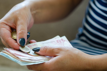 Closeup of woman counting money