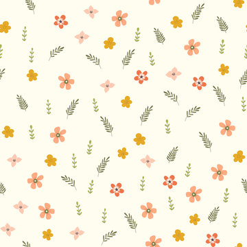 Seamless pattern of small scattered orange flowers and leaves on a cream background.