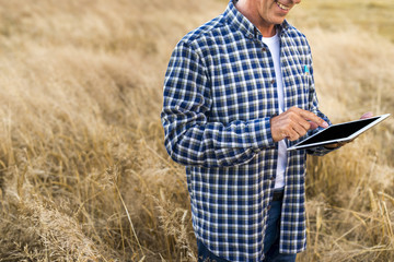 Middle age man holding a tablet