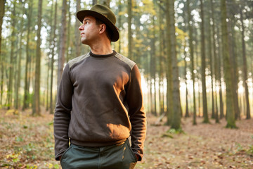 Man as a forester or forestry worker in the forest