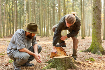 Man training to the forester in the forest