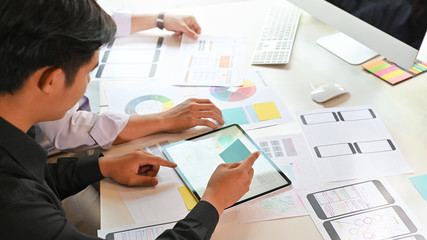 Designer planning application development draft template layout framework and coding program on...