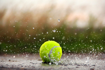Tennis ball in the water. Tennis Ball and Water Drops - 282254487