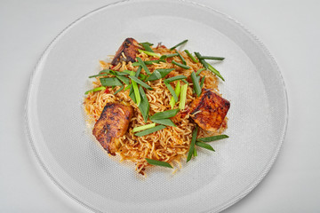 Pilaf with salmon on a white plate