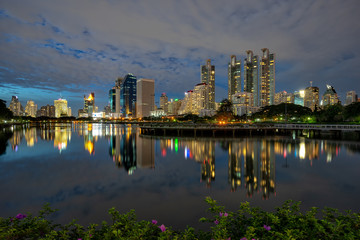Fototapeta na wymiar Night cityscape at Benchakitti Park in Bangkok, Thailand