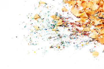 Shavings from multicolored pencils on white