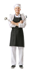 Handsome male chef with kitchenware on white background