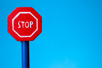 road signal STOP - isolated on blue background