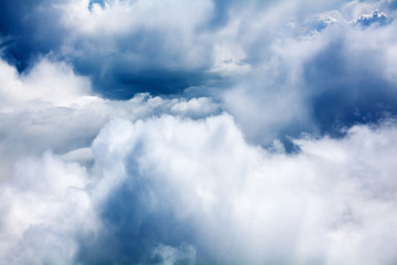 White cumulus clouds, blue sky background closeup, overcast skies backdrop, fluffy cloud texture, beautiful rainy stormy cloudscape heaven, ozone layer or hole illustration, cloudy weather, copy space