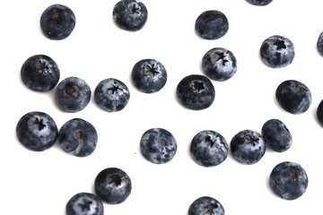 Blurred a pile of fresh blueberries on white isolated background