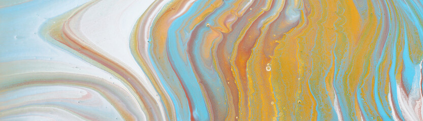 photography of abstract marbleized effect background. Blue, gold and white creative colors. Beautiful paint. banner