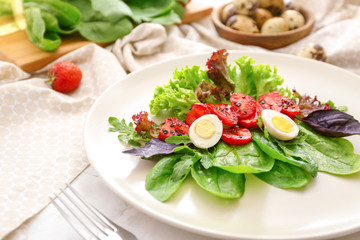Plate with fresh tasty salad on table