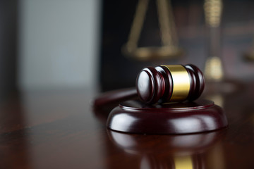 Law concept. Judge's gavel and scale of justice on the gray background.