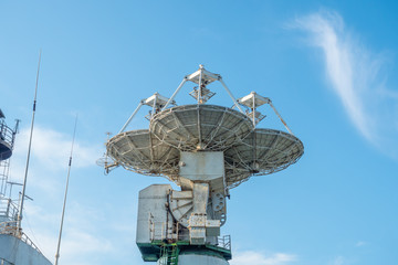 Antennas for communication with spacecraft. Satellite sea vessel with satellite dish.