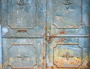 Blue metal doors. Old vintage style. Rusty texture.