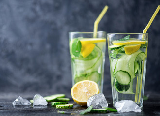 Fototapeta na wymiar Summer cucumber lemonade with lemon and mint. Cold drink lemonade