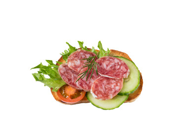 Sandwich with sausage, cucumbers and dill isolated on a white background.