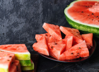 Sliced delicious ripe watermelon on the table close-up