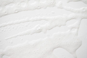 Obraz premium Abstract background white soapy foam texture. Shampoo foam with bubbles