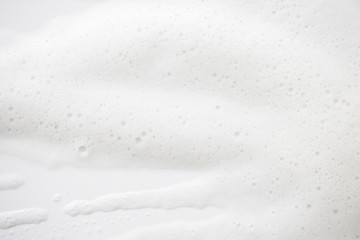 Obraz premium Abstract background white soapy foam texture. Shampoo foam with bubbles