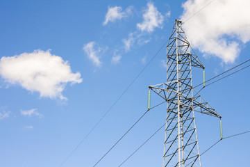 Electric tower and blue sky with white clouds
