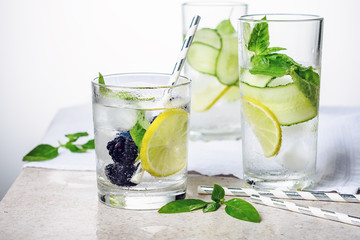 Cooling drink with lime, cucumber, basil and blackberry.