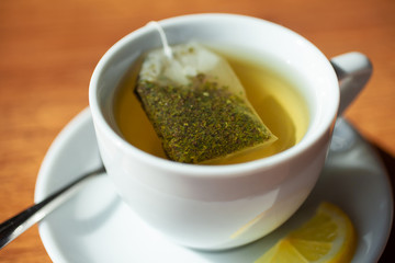 hot Cup of tea. On wooden background
