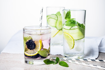 Cooling drink with lime, cucumber, basil and blackberry.