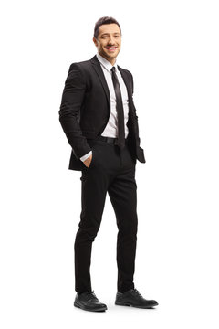 Young Man In A Black Suit Posing