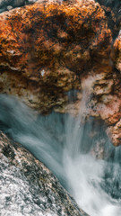 Fototapeta na wymiar water flowing over the rocks