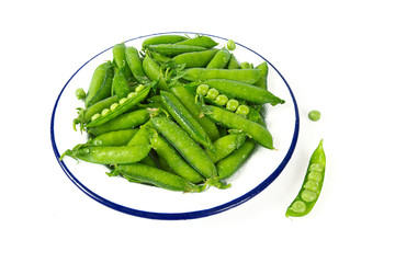 sweet peas on a metallic plate isolated