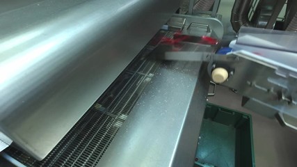 Manufacture of caramel candies. making lollypop. Production of caramel sweets. Lollipops on the production line. Long caramel mass.