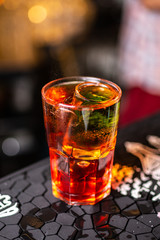 Close-up red cocktail on the bar
