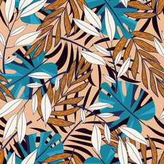 Trend seamless pattern with colorful tropical leaves and plants on beige background. Vector design. Jungle print. Floral background. Printing and textiles. Exotic tropics. Summer design.