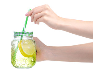 Mason jar glass with lemon water in hand on white background isolation