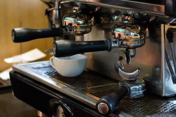 Closeup, professional coffee machine with bottomless filter
