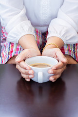 Obraz na płótnie Canvas Female hands holding coffee cup.