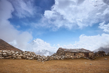 A View of Amphu Gyabjen and Ama Dablan peaks with Old Stone Hut, Everest base camp trek, Nepal