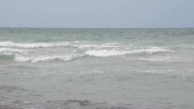 Rough motion waves in Miami Beach on windy day