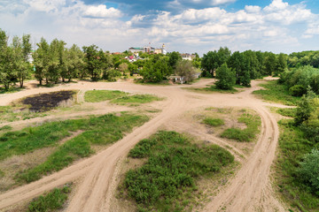 Orenburg, Russia - June, 1, 2019: Urban wasteland on the banks of the Ural River. Summer city landscape