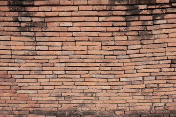 The brick cement wall exture has many horizontal colors which are beautiful background.